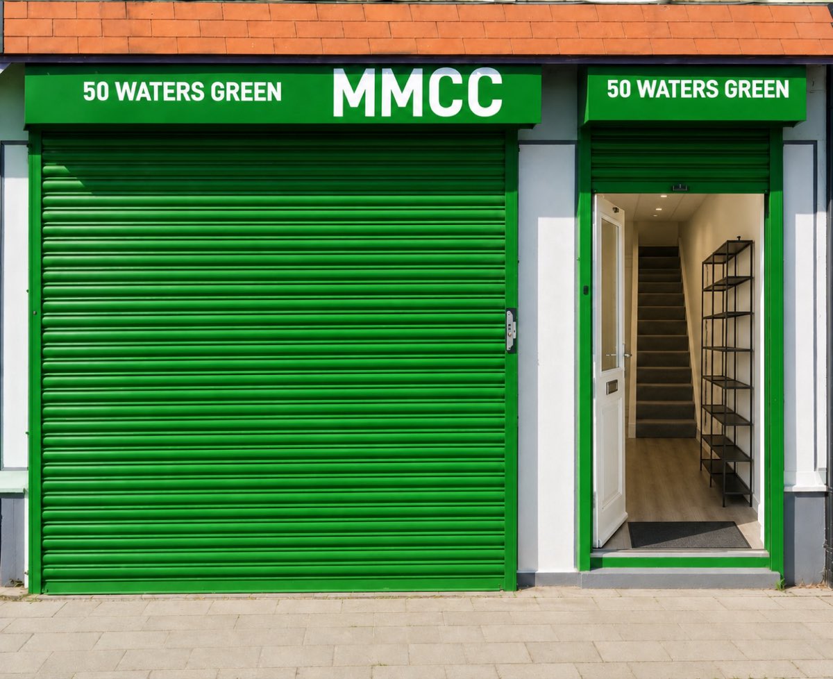 The masjid at 50 Waters Green, with green shutters and the MMCC sign above the doorway.